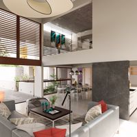 Sala contemporánea de doble altura con comedor integrado, celosías de madera y luz natural cenital